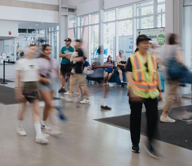 people walking through port coquitlam community centre