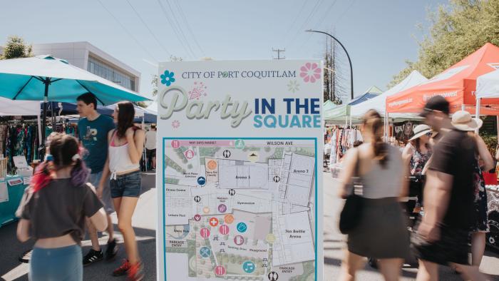 people walking through street festival