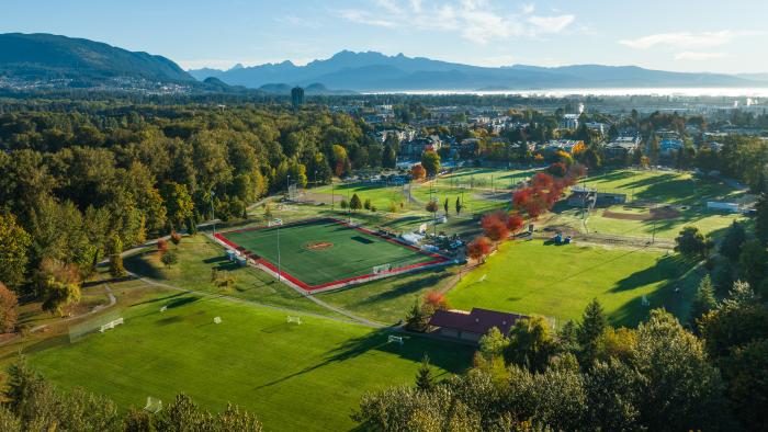 Aerial view of Gates Park showing green spaces, sports fields, mountains and trees
