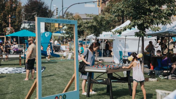 people playing foosball in the park during street festival