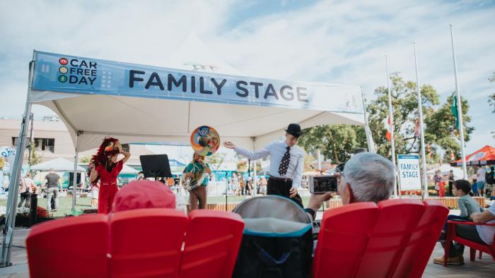 tent with saxophone player and people in chairs watching performance