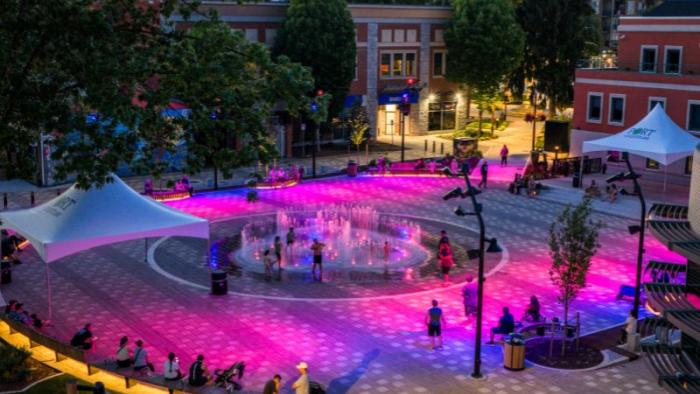 Fountain show in Leigh Square at night with purple and pink lightining