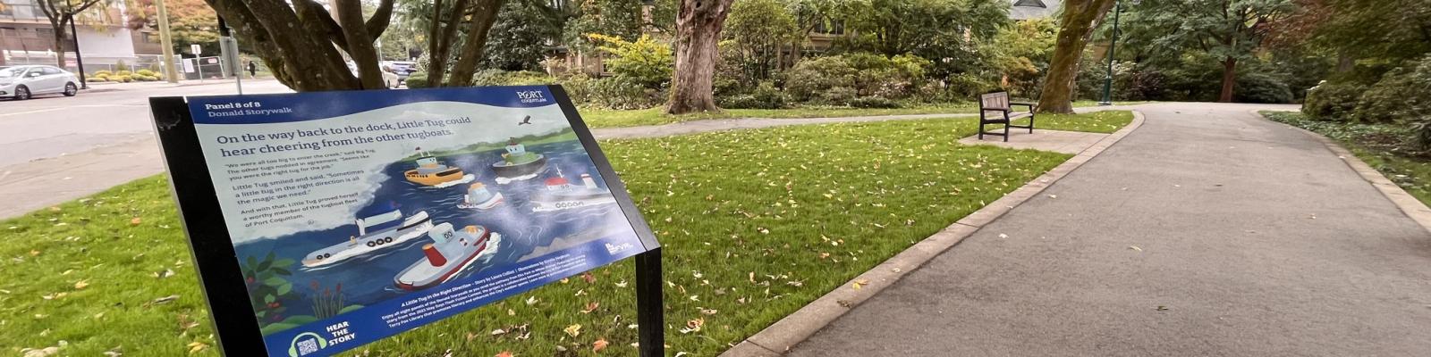 Panel along a pathway with a short story and illustration written on it