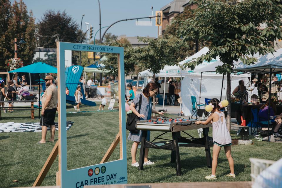 people playing foosball in the park during street festival