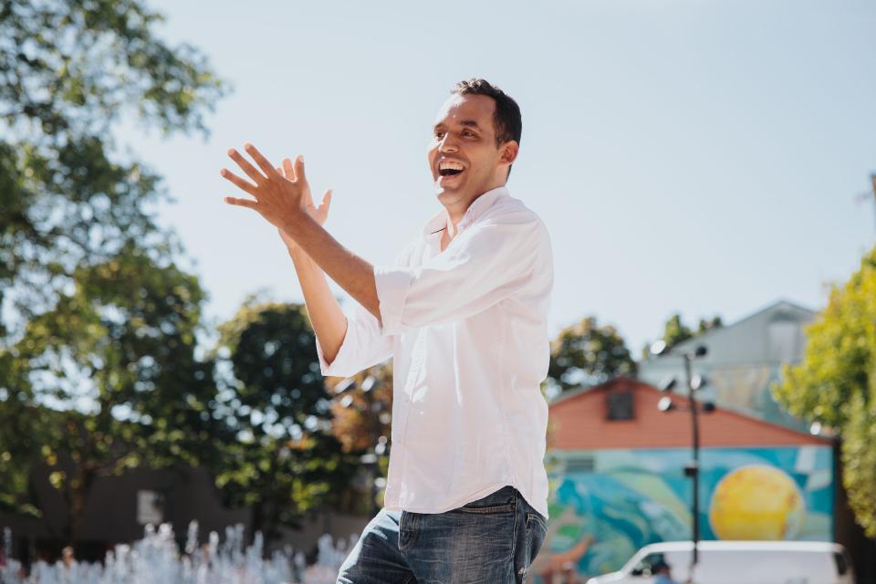 person clapping to music